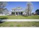 Beautiful two-story home with large front yard, manicured landscaping, and inviting curb appeal at 15594 Garrano Ln, Fishers, IN 46040