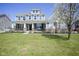 Beautiful two-story home with large front yard, manicured landscaping, and inviting curb appeal at 15594 Garrano Ln, Fishers, IN 46040