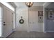 Bright entryway featuring classic trim, a coat rack, and light-colored plank flooring at 15594 Garrano Ln, Fishers, IN 46040