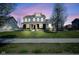 Charming two-story home featuring a well-manicured lawn and beautiful flowering trees at 15594 Garrano Ln, Fishers, IN 46040
