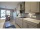 Gourmet kitchen features stainless steel appliances, light cabinets, and a gas cooktop at 15594 Garrano Ln, Fishers, IN 46040