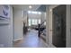 Open living room with high ceilings, large windows, fireplace, and view of the staircase at 15594 Garrano Ln, Fishers, IN 46040
