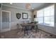 A beautifully decorated office with natural light, a unique light fixture, and stylish decor at 15594 Garrano Ln, Fishers, IN 46040