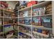 Well-stocked pantry features white wire shelving and ample storage for food, drinks, and kitchen essentials at 15594 Garrano Ln, Fishers, IN 46040