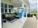 Covered patio with comfortable outdoor seating, hammocks, and elegant patio flooring at 15594 Garrano Ln, Fishers, IN 46040