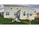 Spacious backyard with a lush lawn, patio set, and charming swing set at 1583 Valdarno Dr, Greenwood, IN 46143