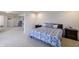 Bedroom with a comfortable bed, rocking chair, and ample natural light, adjacent to other parts of the home at 1583 Valdarno Dr, Greenwood, IN 46143