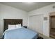 Full bedroom featuring a cozy bed with a wooden headboard and light walls at 1583 Valdarno Dr, Greenwood, IN 46143