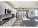 Well-lit kitchen with stainless steel appliances, granite countertops, and open layout to living space at 1583 Valdarno Dr, Greenwood, IN 46143