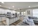 Open-concept living area with modern kitchen, comfortable seating, and ample natural light at 1583 Valdarno Dr, Greenwood, IN 46143