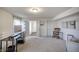 Bright and functional living area with desk space, adjacent to other rooms of the home at 1583 Valdarno Dr, Greenwood, IN 46143
