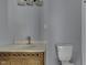 Bathroom features a toilet, vanity, and faucet at 1623 N Centennial St, Indianapolis, IN 46222
