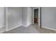 Bedroom with carpet and an open doorway to the bathroom at 1623 N Centennial St, Indianapolis, IN 46222