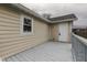 An elevated view shows the spacious deck attached to this beige home with white trim at 1623 N Centennial St, Indianapolis, IN 46222