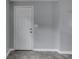 This interior view showcases the front door, gray walls, and modern tile flooring at 1623 N Centennial St, Indianapolis, IN 46222