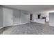An open-concept floor plan showcases the living area and kitchen's stylish gray accents at 1623 N Centennial St, Indianapolis, IN 46222