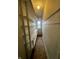 This long hallway has built in shelves and a window at the end for natural light at 1626 S State Ave, Indianapolis, IN 46203