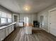 Open kitchen with laminate floors, center island, stainless appliances, and great natural light at 1626 S State Ave, Indianapolis, IN 46203