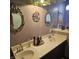 Bathroom with double sinks, butterfly decor and two ornate mirrors at 1647 S Plateau Cir, Martinsville, IN 46151