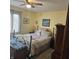 Cozy bedroom with a metal framed bed, neutral bedding, and light yellow walls at 1647 S Plateau Cir, Martinsville, IN 46151