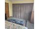 Bedroom with large, wood, sliding closet doors and a metal bed frame at 1647 S Plateau Cir, Martinsville, IN 46151