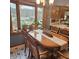 Cozy dining room featuring a large window with scenic lake views, chandelier and a dining table perfect for meals at 1647 S Plateau Cir, Martinsville, IN 46151