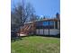 Exterior view showcasing the deck, screened sunroom, and yard of the home at 1647 S Plateau Cir, Martinsville, IN 46151