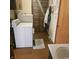 A functional laundry room with a washer, dryer, utility sink, storage, and convenient access offers practicality and efficiency at 1647 S Plateau Cir, Martinsville, IN 46151