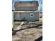 A spacious backyard, great for outdoor activities, with a grill and a shed at 1708 W 7Th St, Muncie, IN 47302