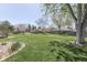 Spacious backyard with lush green grass, mature trees, and a partial view of the house at 1772 Woodridge Pl, Greenwood, IN 46143