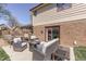 Backyard patio with comfortable seating, a fire pit, and a sliding door entrance to the home at 1772 Woodridge Pl, Greenwood, IN 46143