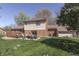 Beautiful backyard featuring a well-maintained lawn, deck, and patio seating area at 1772 Woodridge Pl, Greenwood, IN 46143