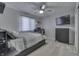 Comfortable bedroom featuring a ceiling fan, dresser, and TV at 1772 Woodridge Pl, Greenwood, IN 46143