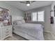 Bedroom with a bed, window, night stand and decorative wall art at 1772 Woodridge Pl, Greenwood, IN 46143