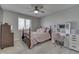 Bedroom includes a bed with a decorative bed frame and a vanity desk at 1772 Woodridge Pl, Greenwood, IN 46143