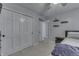 Bedroom featuring a large closet with sliding doors, decor shelves, and a neutral color scheme at 1772 Woodridge Pl, Greenwood, IN 46143