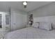 Comfortable bedroom featuring patterned bedding and a ceiling fan for a relaxing atmosphere at 1772 Woodridge Pl, Greenwood, IN 46143