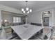 Spacious dining area with a marble top table open to living room and kitchen at 1772 Woodridge Pl, Greenwood, IN 46143