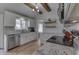 Elegant kitchen with white cabinets, granite countertops and stainless steel dishwasher at 1772 Woodridge Pl, Greenwood, IN 46143
