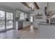 Bright kitchen with white cabinets, stainless steel appliances, and sliding door to the deck at 1772 Woodridge Pl, Greenwood, IN 46143