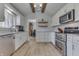 Stylish kitchen featuring granite countertops, white cabinets, and stainless steel appliances at 1772 Woodridge Pl, Greenwood, IN 46143