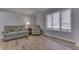 Cozy living room with comfortable seating, a lamp, and a bright window at 1772 Woodridge Pl, Greenwood, IN 46143