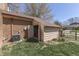 Exterior view of a brick shed with an open door, located next to the home's exterior at 1772 Woodridge Pl, Greenwood, IN 46143