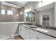Modern bathroom with double vanity, tiled shower, and neutral color palette at 19414 Mcbee Ave, Westfield, IN 46074