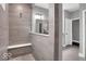 Contemporary bathroom with a tiled shower featuring a glass partition and a built-in bench at 19414 Mcbee Ave, Westfield, IN 46074