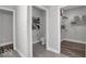 Bathroom featuring a toilet and a walk-in closet with white shelving and gray storage boxes at 19414 Mcbee Ave, Westfield, IN 46074