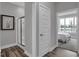 Bathroom featuring a glass shower, modern fixtures, and a view into the main bedroom at 19414 Mcbee Ave, Westfield, IN 46074