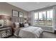 Bedroom boasts a large window with scenic views and is decorated with modern furnishings at 19414 Mcbee Ave, Westfield, IN 46074