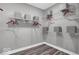 Closet features wire shelving with red hangers, and gray storage boxes on wood look floors at 19414 Mcbee Ave, Westfield, IN 46074