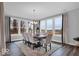 Bright dining room with large windows, wood table, chandelier, and neutral decor at 19414 Mcbee Ave, Westfield, IN 46074
